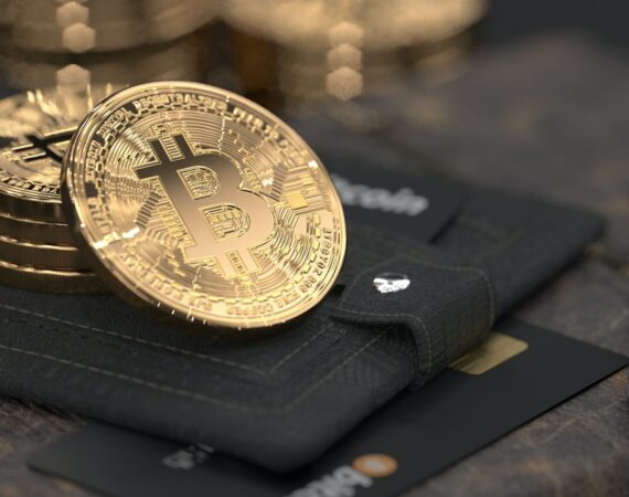 silver round coin on black leather case